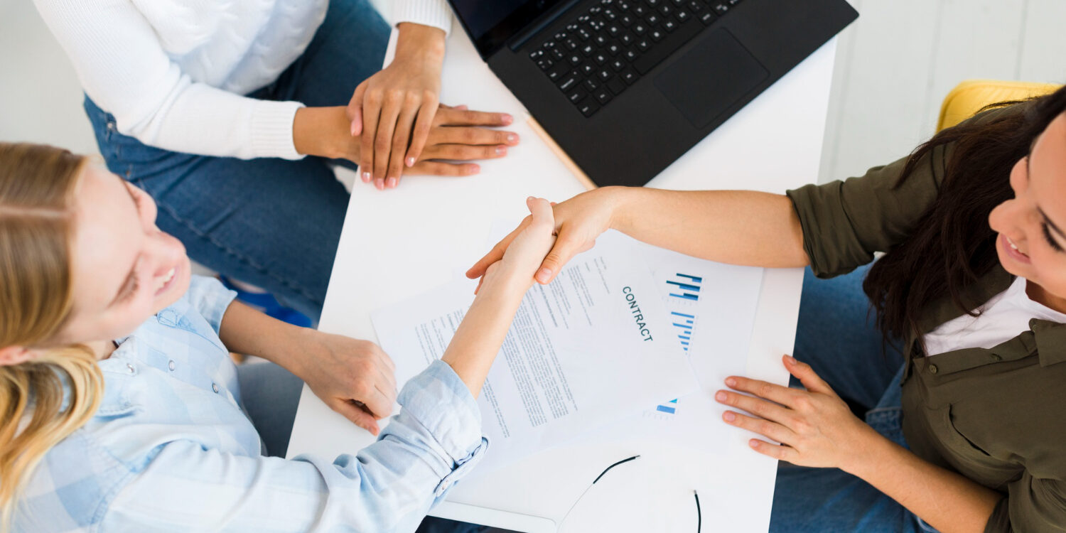 top-view-females-shaking-hands
