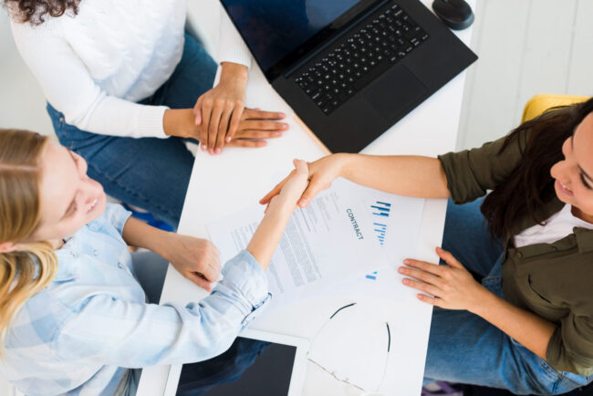 top-view-females-shaking-hands
